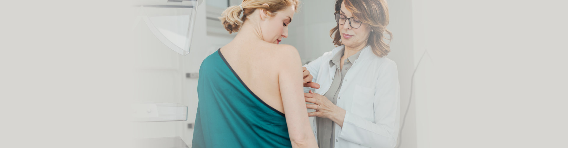 a woman having a breast consultation to the doctor